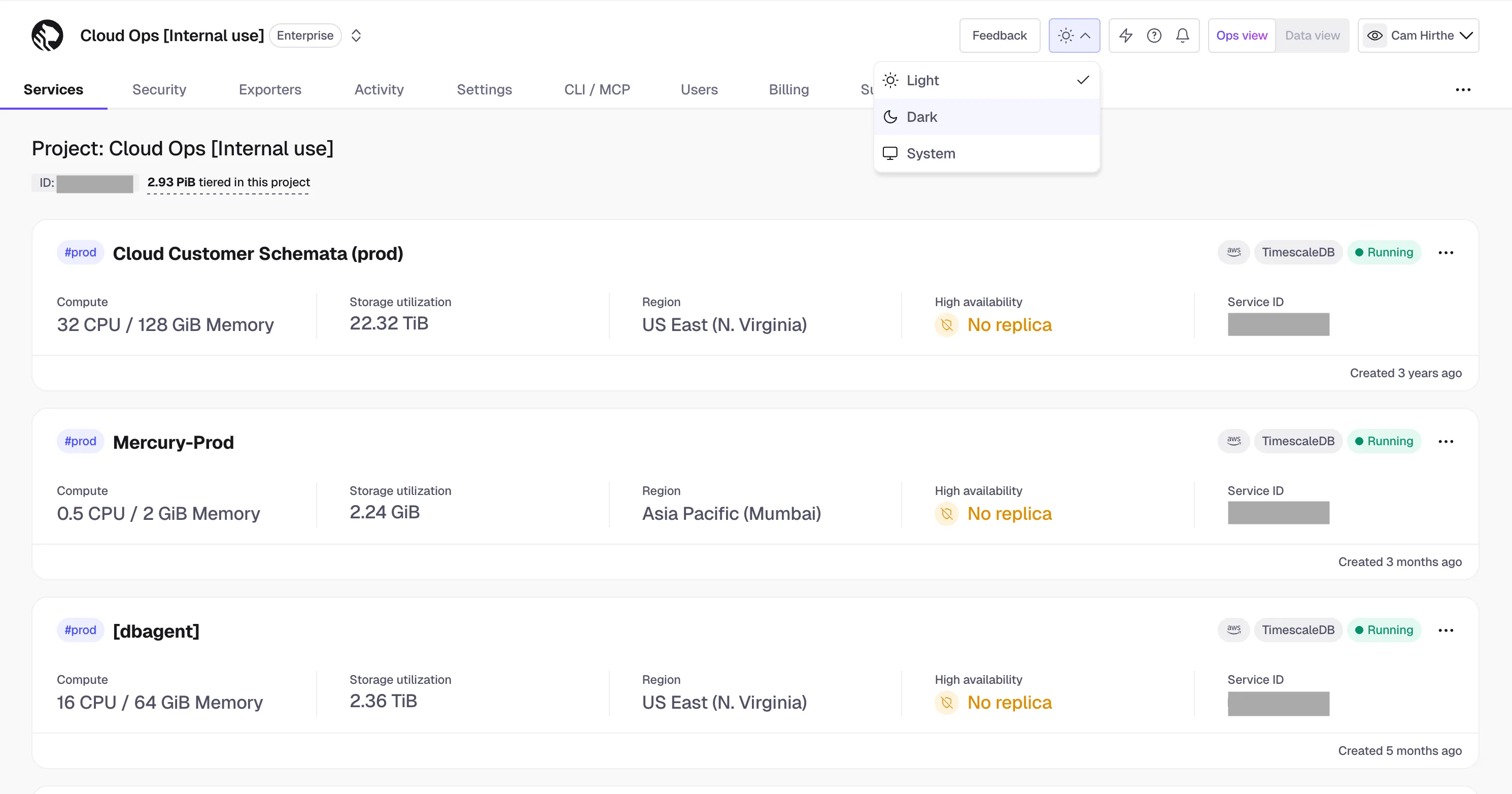 Theme toggle in Tiger Cloud Console showing Light, Dark, and System options